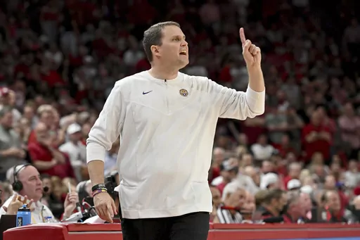 Then-LSU coach Will Wade gestures during the first half of the team's NCAA college basketball game against Arkansas, March 2, 2022, in Fayetteville, Ark. First-year McNeese State coach Wade has signed a five-year contract extension worth at least $700,000 per year. Wade resumed coaching this season for the first time since being fired by LSU in 2022 because of NCAA recruiting violations. (AP Photo/Michael Woods, File)