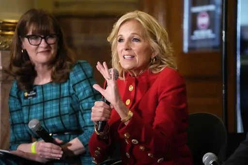 First lady Jill Biden, front, makes a point as Colorado Speaker of the House Julie McCluskie looks on during a stop to attend a roundtable discussion on the federal workforce training program to help community college students earn certificates for entry-level jobs Monday, April 3, 2023, inside the State Capitol in Denver. Both Republican and Democratic state lawmakers were on hand for the first lady's visit, the first of four stops across the country to promote the Biden Administration's effort