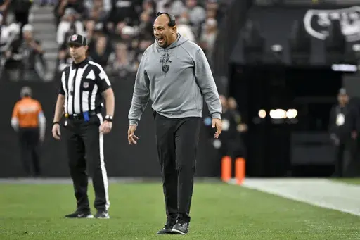 Las Vegas Raiders head coach Antonio Pierce shouts instructions on the field during the first half of an NFL football game against the Jacksonville Jaguars Sunday, Dec. 22, 2024, in Las Vegas. (AP Photo/David Becker)
