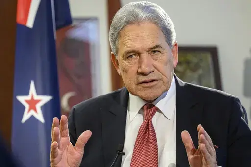 New Zealand Foreign Minister Winston Peters comments during an interview with The Associated Press in his parliamentary office in the capital, Wellington, Thursday, Aug. 22, 2024. (AP Photo/Mark Tantrum)