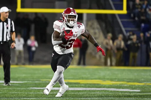 Temple running back Edward Saydee (23) runs the ball during the second half of an NCAA college football game against Navy, Saturday, Oct. 29, 2022, in Annapolis, Md. (AP Photo/Terrance Williams)