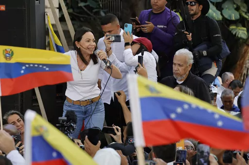 Opposition coalition presidential hopeful Maria Corina Machado speaks to supporters at a campaign event in Caracas, Venezuela, Jan. 23, 2024. As a March 25, 2024 deadline nears to register to compete in the presidential election, Machado faces pressure from foreign leaders and fellow government opponents to abandon her dead-end candidacy, because she’s technically barred from office. (AP Photo/Jesus Vargas, File)