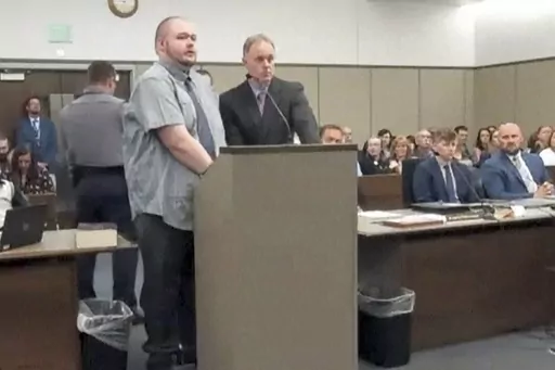 In this image taken from video provided by the Colorado Judicial Branch, Anderson Lee Aldrich, left, the suspect in a mass shooting that killed five people at a Colorado Springs LGBTQ+ nightclub in 2022, appears in court, June 26, 2023, in Colorado Springs, Colo., where they pleaded guilty in the attack. Aldrich was charged with federal hate crimes on Tuesday, Jan. 16, 2024. (Colorado Judicial Branch via AP, File)