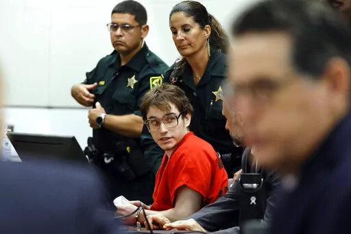 Parkland shooter Nikolas Cruz is escorted from the courtroom after his sentencing at the Broward County Courthouse in Fort Lauderdale, Fla., on Wednesday, Nov. 2, 2022. Cruz was sentenced to life in prison for murdering 17 people at Parkland's Marjory Stoneman Douglas High School more than four years ago. (Amy Beth Bennett/South Florida Sun Sentinel via AP, Pool)