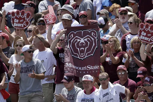 Fans hold Missouri State flags during a tournament in Fayetteville, Ark., Sunday, June 7, 2015. Missouri State is moving up to the highest tier of Division I college football and joining Conference USA in 2025. (AP Photo/Danny Johnston, File)