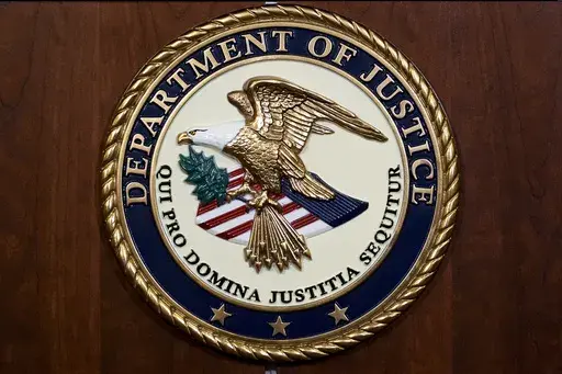 The seal of the Department of Justice, Aug. 1, 2023, at the Department of Justice in Washington. (AP Photo/J. Scott Applewhite, File)