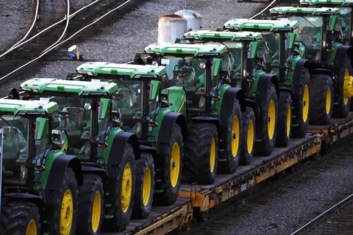 A consist of John Deere tractors sit in Norfolk Southern's Conway Yard in Conway, Pa., Monday, Dec. 5, 2022. On Thursday, the Labor Department releases the producer price index for January, an indicator of inflation at the wholesale level that's closely monitored by the Federal Reserve. (AP Photo/Gene J. Puskar, File)