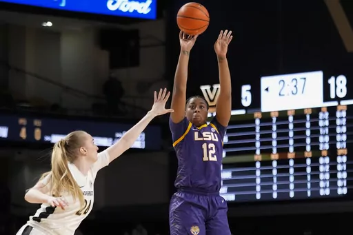 LSU guard Mikaylah Williams (12) shoots the ball over Vanderbilt guard Aga Makurat (24) during the first half of an NCAA college basketball game Thursday, Feb. 8, 2024, in Nashville, Tenn. (AP Photo/George Walker IV)