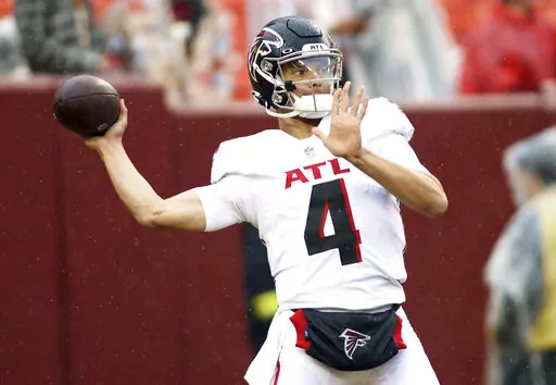 Atlanta Falcons quarterback Desmond Ridder (4) throws before an NFL football game against the Washington Commanders on Nov. 27, 2022, in Landover, Md. The Atlanta Falcons will have more on the line than retaining hope in the weak NFC South race as rookie quarterback Ridder makes his debut as the starter on Sunday, Dec. 18, at New Orleans. (AP Photo/Daniel Kucin Jr., File)