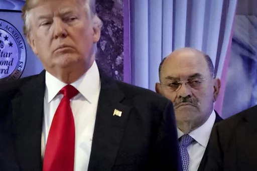 Allen Weisselberg, right, stands behind then President-elect Donald Trump during a news conference in the lobby of Trump Tower in New York, Jan. 11, 2017. A New York judge ruled Friday, Feb. 16, 2024, against Donald Trump, imposing a $364 million penalty over what the judge ruled was a yearslong scheme to dupe banks and others with financial statements that inflated the former president's wealth. (AP Photo/Evan Vucci, File)