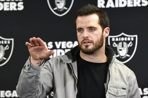 Las Vegas Raiders quarterback Derek Carr meets with reporters after an NFL football game against the Pittsburgh Steelers in Pittsburgh, Saturday, Dec. 24, 2022. Former Raiders quarterback Derek Carr has agreed to a four-year contract with the New Orleans Saints, two people familiar with the agreement said Monday, March 6, 2023. (AP Photo/Don Wright, File)