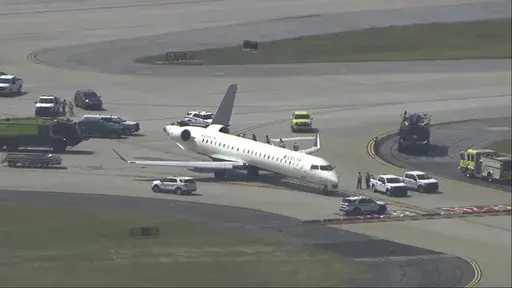 A plane sits damaged at Hartsfield-Jackson Atlanta International Airport after colliding with another plane on a taxiway, Tuesday, Sept. 10, 2024. (WSB via AP)