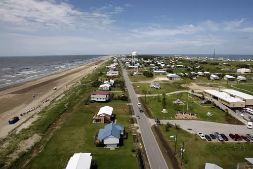 Louisiana State Highway 1 is seen from above Grand Isle, La., on July 27, 2010. Grand Isle will repeal an anti-obscenity ordinance and let a contractor fly a flag from his truck that carries an obscenity aimed at President Joe Biden, under the terms of a lawsuit settlement filed Friday, Sept. 15, 2023, in federal court. (AP Photo/Patrick Semansky, File)