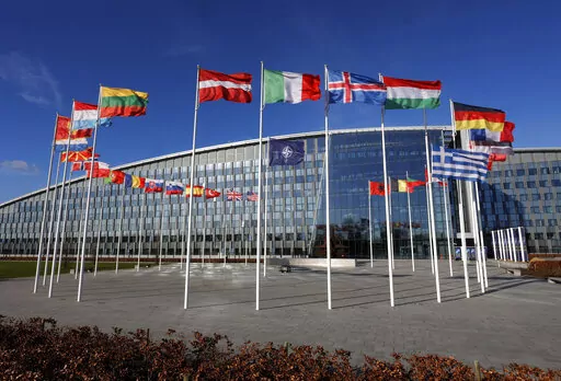Flags flutter in the wind outside NATO headquarters in Brussels, Feb. 7, 2022. With Finland and Sweden taking steps to join NATO, the list of “neutral” countries in Europe appears poised to shrink. Security concerns over Russia’s ongoing invasion of Ukraine changed the calculus for Finland and Sweden which have long espoused neutrality and caused other traditionally “neutral” countries to re-think what that term really means for them. (AP Photo/Olivier Matthys, File)