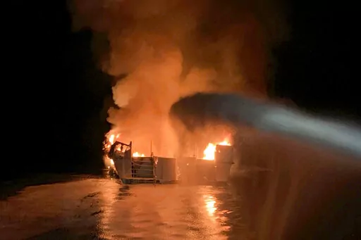 In this photo provided by the Ventura County Fire Department, VCFD firefighters respond to a fire aboard the Conception dive boat fire in the Santa Barbara Channel off the coast of Southern California on Sept. 2, 2019. On Friday, Sept. 2, 2022, a federal judge has thrown out an indictment charging a boat captain with manslaughter in the deaths of 34 scuba divers three years ago off the California coast  (Ventura County Fire Department via AP, File)