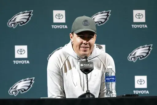Philadelphia Eagles offensive coordinator Kellen Moore speaks with members of the media during a news conference at the NFL football team's training facility, Tuesday, Jan. 21, 2025, in Philadelphia. (AP Photo/Chris Szagola)