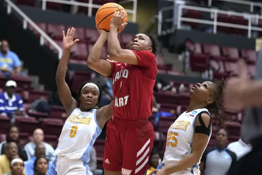 Sacred Heart guard Ny'Ceara Pryor (1) shoots between Southern's Diamond Hunter (0) and Genovea Johnson (25) during the first half of a First Four game in the NCAA women's college basketball tournament Wednesday, March 15, 2023, in Stanford, Calif. (AP Photo/Tony Avelar)