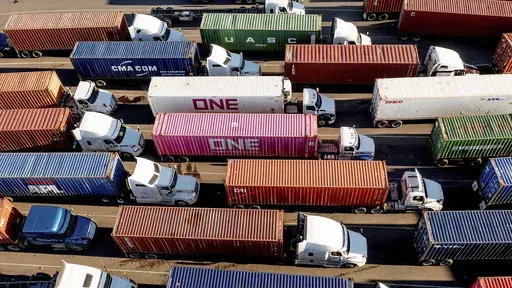 Trucks line up to enter a Port of Oakland shipping terminal on Nov. 10, 2021, in Oakland, Calif. (AP Photo/Noah Berger, File)