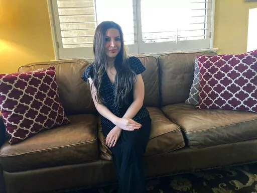 Lea Rodger, 32, poses for a photo on March 28, 2022, in McAlester, Okla., the day before she married Oklahoma death row-inmate Richard Glossip, at the Oklahoma State Penitentiary. Glossip has tied the knot in prison for the second time. Glossip, who was convicted of a 1997 murder-for-hire married fiance Lea Rodger on Tuesday, March 29, 2022, inside the state penitentiary in McAlester. (AP Photo/Sean Murphy)