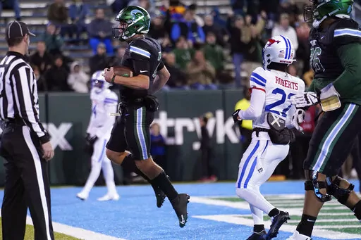 Tulane quarterback Michael Pratt (7) celebrates his touchdown carry during the first half of an NCAA college football game against Southern Methodist in New Orleans, Thursday, Nov. 17, 2022. (AP Photo/Gerald Herbert)