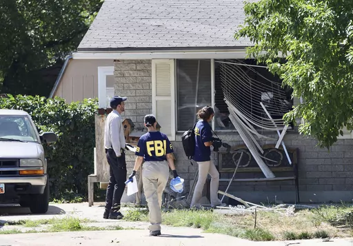 Law enforcement investigate the scene of a shooting involving the FBI on Aug. 9, 2023, in Provo, Utah. The Utah man accused of making violent threats against President Joe Biden before a western states trip last week pointed a handgun at FBI agents attempting to arrest him, the agency said on Monday, Aug. 14, 2023. (Laura Seitz/The Deseret News via AP, File)