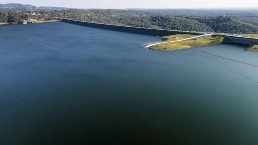 The Oroville Dam, top right, holds back water at Lake Oroville on March 25, 2023, in Butte County, Calif. Regulators say California will provide 100% of the water requested by cities and farms for the first time in years thanks to winter storms that filled reservoirs and runoff from a record snowpack. (AP Photo/Noah Berger, File)