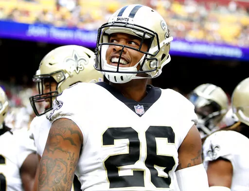 New Orleans Saints cornerback P.J. Williams (26) smiles during an NFL football game against the Washington Football Team, Oct. 10, 2021, in Landover, Md. A person familiar with the decision says the Saints are bringing back veteran defensive back Williams on a one-year contract. The person spoke to The Associated Press on condition of anonymity on Saturday, April 2, 2022, because the agreement has not been announced. (AP Photo/Daniel Kucin Jr., File)