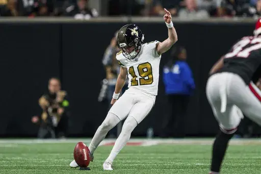 New Orleans Saints place kicker Blake Grupe (19) kicks off during the first half of an NFL football game against the Atlanta Falcons, Sunday, Nov. 26, 2023, in Atlanta. The Atlanta Falcons won 24-15. (AP Photo/Danny Karnik)