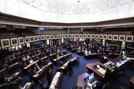Members of the Florida House of Representatives convene during a legislative session April 30, 2021, at the Capitol in Tallahassee, Fla. On Tuesday, Feb. 22, 2022, Florida House Republicans advanced a bill, dubbed by opponents as the “Don’t Say Gay” bill, to forbid discussions of sexual orientation and gender identity in schools, rejecting criticism from Democrats who said the proposal demonizes LGBTQ people. (AP Photo/Wilfredo Lee, File)