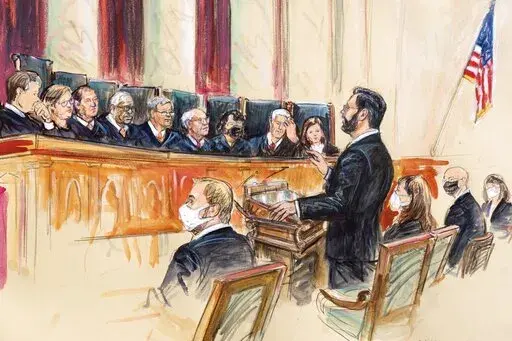 This artist sketch depicts Marc Hearron, petitioner for Whole Woman's Health, standing while speaking to the Supreme Court, Monday, Nov. 1, 2021, in Washington. Seated to Hearron's left is Judd Stone II, Texas Solicitor General. Justices seated from left are Associate Justice Brett Kavanaugh, Associate Justice Elena Kagan, Associate Justice Samuel Alito, Associate Justice Clarence Thomas, Chief Justice John Roberts, Associate Justice Stephen Breyer, Associate Justice Sonia Sotomayor, Associated 