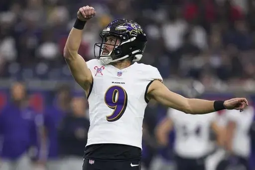 Baltimore Ravens place kicker Justin Tucker (9) watches his extra point against the Houston Texans during the first half of an NFL football game Wednesday, Dec. 25, 2024, in Houston. (AP Photo/Eric Christian Smith, File)