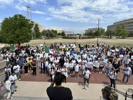 Oklahoma City immigration attorney Sam Wargin Grimaldo speaks to a group outside the Oklahoma Capitol on Tuesday, April 23, 2024, who opposed a bill that would impose criminal penalties to be in the state illegally. Oklahoma is one of several GOP-led states seeking to give broader immigration enforcement powers to local police. (AP Photo/Sean Murphy)