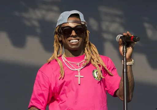 In this June 16, 2018, file photo, Lil Wayne performs on Day 3 of the 2018 Firefly Music Festival at The Woodlands in Dover, Del. Grammy Award-winning rapper Lil Wayne visited the World Series champion Houston Astros Tuesday, May 2, 2023 before their game against the San Francisco Giants. (Photo by Owen Sweeney/Invision/AP, File)