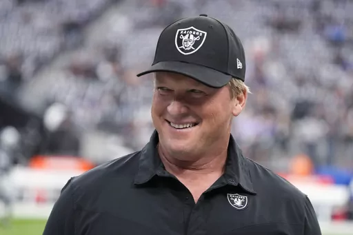 Las Vegas Raiders coach Jon Gruden smiles, at the NFL football team's game against the Baltimore Ravens on Sept. 13, 2021, in Las Vegas. Former Raiders coach Gruden was among a handful of invited guests who observed New Orleans Saints voluntary offseason practices this week. A person familiar with the situation confirmed Gruden’s presence during the Saints’ first week of voluntary practices with new quarterback Derek Carr under center. (AP Photo/Rick Scuteri, File)