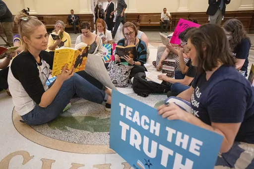 Protesters read books in the middle of the Texas Capitol rotunda in Austin, Texas, as The Texas Freedom Network holds a "read-in," April 19, 2023, to protest a bill that would ban sexually explicit materials from library books in schools. On Wednesday, Jan. 17, 2024, an order blocking enforcement of the Texas law requiring vendors to evaluate and rate the sexual content of books they sell, or have sold, to schools has been upheld by a federal appeals court. (Mikala Compton/Austin American-States
