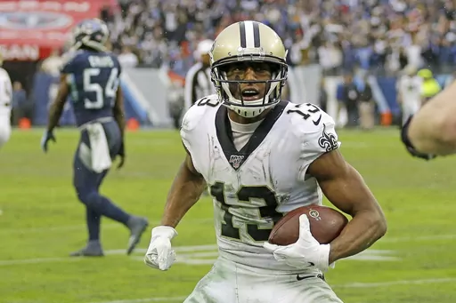 In this Dec. 22, 2019, file photo, New Orleans Saints wide receiver Michael Thomas (13) scores a touchdown on a 2-yard pass reception against the Tennessee Titans during the second half of an NFL football game in Nashville, Tenn. A person familiar with the situation says New Orleans Saints receiver Michael Thomas has agreed to a new one-year contract worth between $10 million and $15 million for the 2023 season. The person spoke to The Associated Press on condition of anonymity on Tuesday, March