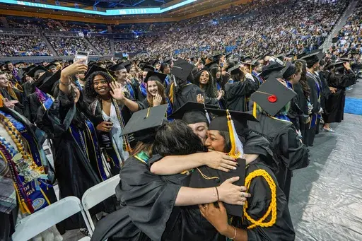UCLA students celebrate during a commencement ceremony inside Pauley Pavilion on UCLA campus, in Los Angeles, June 14, 2024. (AP Photo/Damian Dovarganes, File)