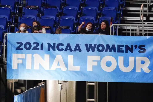 Fans watch from the stands during the first half of the championship game between Stanford and Arizona in the women's Final Four NCAA college basketball tournament in San Antonio, April 4, 2021. A year after the NCAA got called out for gender inequities between its men’s and women’s basketball tournaments, the organization has made changes over the past six months to make it more equitable. (AP Photo/Eric Gay, File)