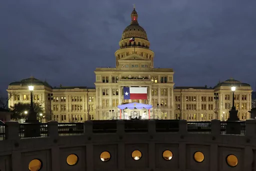 In this Jan. 14, 2019 file photo, a large Texas flag hangs from the Texas State Capitol in Austin, Texas. A federal judge has struck down a Texas law requiring age verification and health warnings to view pornographic websites and blocked the state attorney general's office from enforcing it. U.S. District Judge David Ezra on Thursday, Aug. 31, 2023 agreed with claims that the bill signed into law by Gov. Greg Abbott in June violates free speech rights, is overbroad and vague.(AP Photo/Eric Gay,