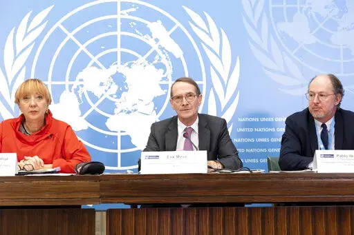 Erik Mose, center, Chair of the Commission of Inquiry on Ukraine, Jasminka Dzumhur, left, and Pablo de Greiff, right, Commissioners of Inquiry on Ukraine, talk to the media during a press conference following an update to the UN Human Rights Council, at the European headquarters of the United Nations in Geneva, Switzerland, Friday, Sept. 23, 2022. A team of experts commissioned by the U.N.’s top human rights body to look into rights violations in Ukraine said Friday its initial investigation t