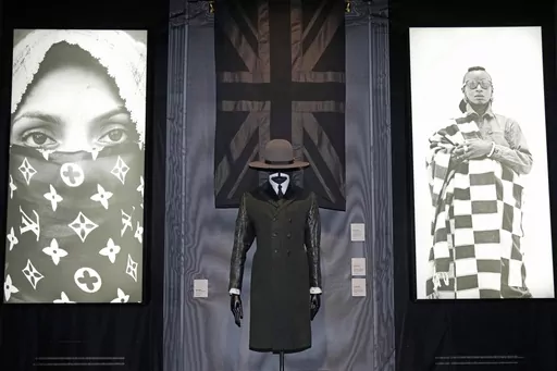 A black union jack shawl, Madhatter crown hat and Rudie coat designed by London-based art collective Art Comes First, are displayed during a preview of the exhibition titled "The Missing Thread: Untold Stories of Black British Fashion", at Somerset House, in London, Tuesday, Sept. 19, 2023. A new exhibition is opening in London to chart for the first time the contributions Black British culture made to U.K. fashion and design history and to celebrate Black designers who have not received public 