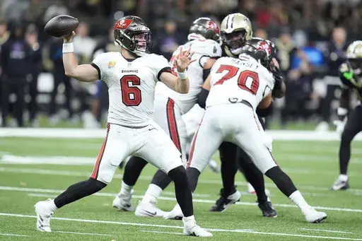 Tampa Bay Buccaneers quarterback Baker Mayfield (6) passes against the New Orleans Saints during the first half of an NFL football game in New Orleans, Sunday, Oct. 13, 2024. (AP Photo/Michael Conroy)