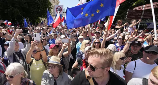 Participants join an anti-government march led by the centrist opposition party leader Donald Tusk, who along with other critics accuses the government of eroding democracy, in Warsaw, Poland, Sunday, June 4, 2023. Poland's largest opposition party led a march Sunday meant to mobilize voters against the right-wing government, which it accuses of eroding democracy and following Hungary and Turkey down the path to autocracy. The march is being held on the 34th anniversary of the first partly free 