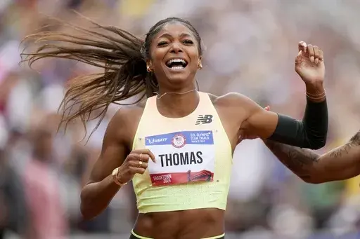 Gabby Thomas celebrates after winning the women's 200-meter final during the U.S. Track and Field Olympic Team Trials Saturday, June 29, 2024, in Eugene, Ore. (AP Photo/Charlie Neibergall)