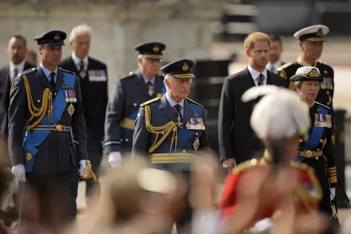 King Charles III and other members of Royal family follow the coffin of Queen Elizabeth II, during a procession from Buckingham Palace to Westminster Hall in London, Wednesday, Sept. 14, 2022. King Charles III will hope to keep a lid on those tensions when his royally blended family joins as many as 2,800 guests for the new king’s coronation on May 6 at Westminster Abbey. All except Meghan, the Duchess of Sussex, who won’t be attending. (AP Photo/Markus Schreiber, File)