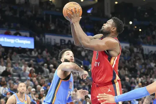 New Orleans Pelicans forward Zion Williamson, right, looks to shoot over OKlahoma City Thunder forward Kenrich Williams, front left, during the second half of an NBA basketball game, Monday, Feb. 10, 2025, in Oklahoma City. (AP Photo/Kyle Phillips)