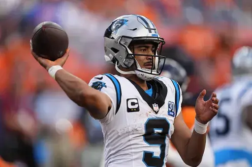 Carolina Panthers quarterback Bryce Young looks to throw a pass late in the second half of an NFL football game against the Denver Broncos, Sunday, Oct. 27, 2024, in Denver. (AP Photo/David Zalubowski)