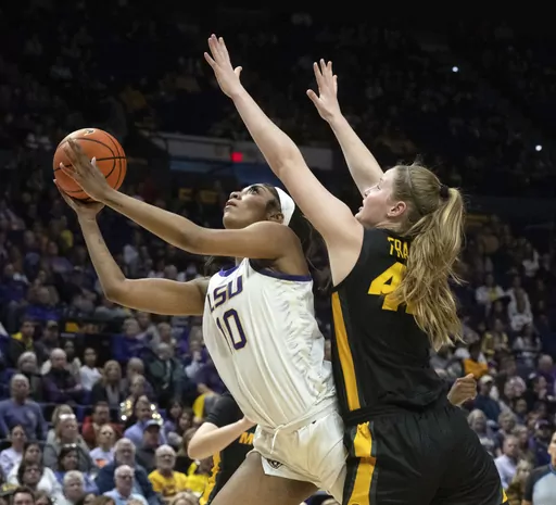 LSU forward Angel Reese (10) drives past Missouri forward Hayley Frank (43) during an NCAA college basketball game Thursday, Jan. 4, 2024, in Baton Rouge, La. As March Madness is set to tip off, three of the most recognizable names in college basketball are in the women’s tournament: Caitlin Clark, Angel Reese and Paige Bueckers.(Hilary Scheinuk/The Advocate via AP, File)