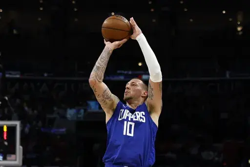 Los Angeles Clippers' Daniel Theis looks to shoot a 3-point basket during the first half of an NBA basketball game against the Utah Jazz, April 5, 2024, in Los Angeles. The New Orleans Pelicans and veteran NBA center Theis have agreed to terms on a one-year contract, a person familiar with the agreement said. The person spoke to The Associated Press on condition of anonymity Monday, July 8, 2024, because the agreement has not been announced. (AP Photo/Etienne Laurent, File)