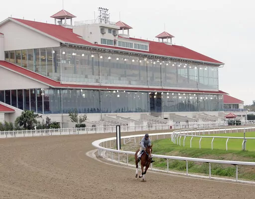 A hore goes through an early morning workout for the first time since Hurricane Katrina at the Fair Ground Race Track in New Orleans, La., on Nov. 2, 2006. A federal appeals court has ruled Friday, Nov. 18, 2022, that Congress gave too much power to a nonprofit authority it created in 2020 to develop and enforce horseracing rules. The 5th U.S. Circuit Court of Appeals said that the Horseracing Integrity and Safety Act is “facially unconstitutional.”(AP Photo/Bill Haber, File)